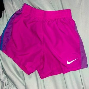 Purple Nike shorts. Size large girls but could fit a 00. Great condition.